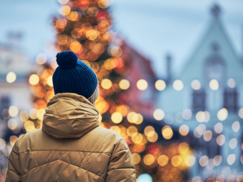 person looking at Christmas lights